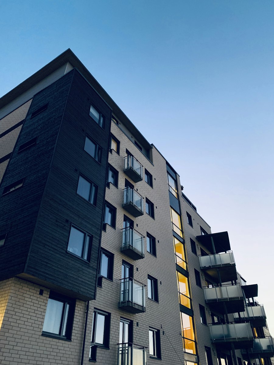 A newly built brick and timber apartment building seen from below