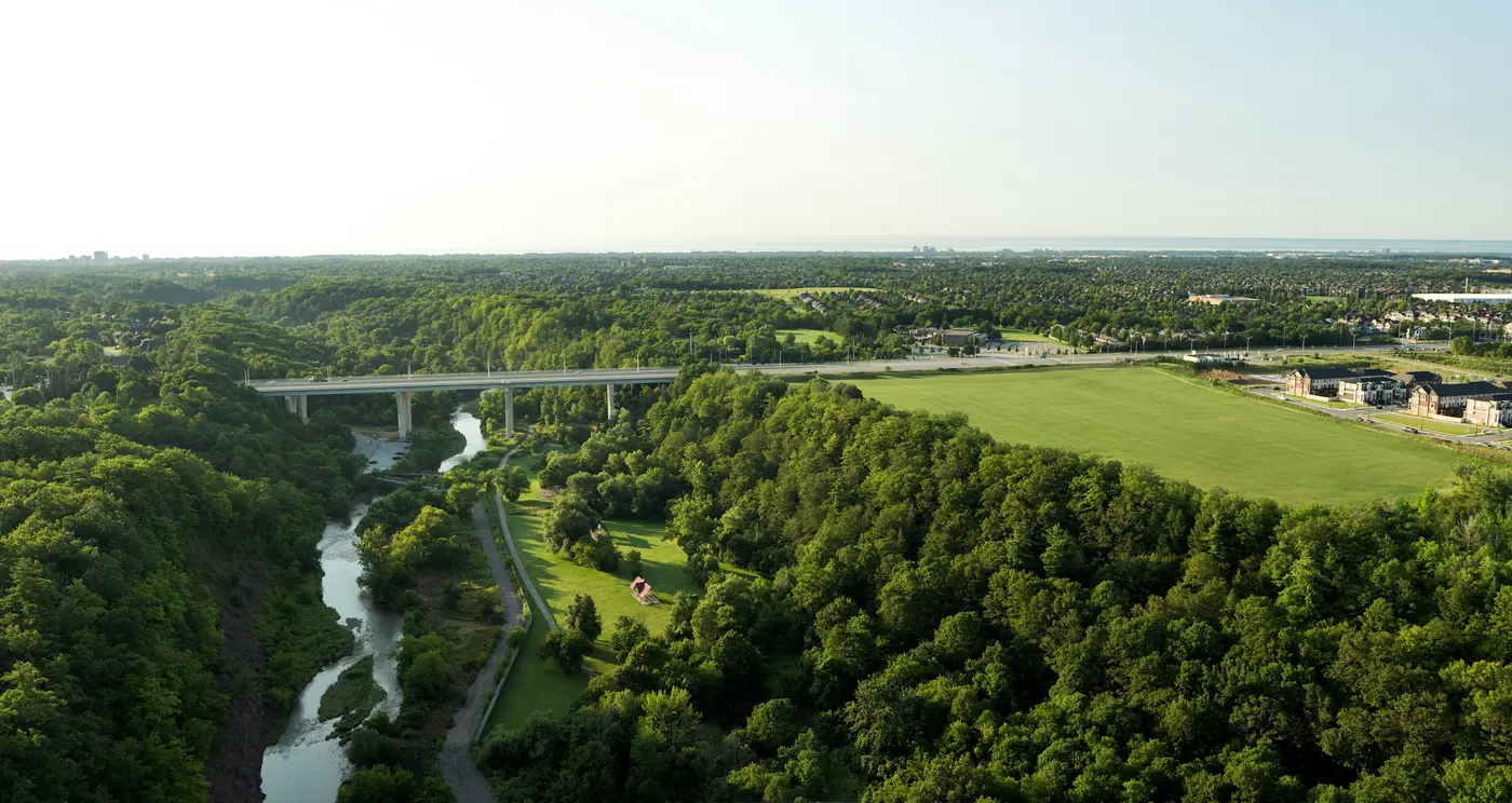 Aerial photograph of the wooded Sixteen Mile Creek valley in Oakville, for context
